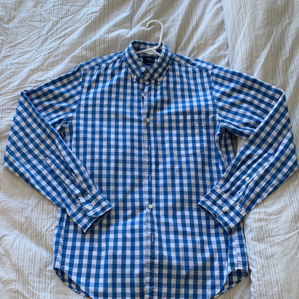 Size small blue and white checkered button up shirt.